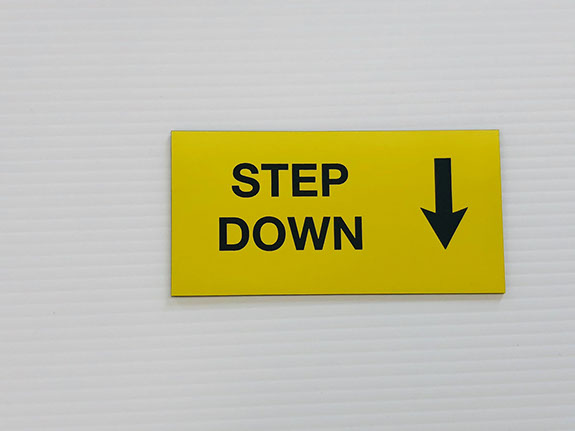 Yellow acrylic piece with black engraved