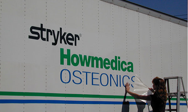 Vinyl being applied on a truck