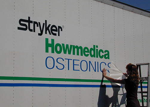 Vinyl being applied on a truck
