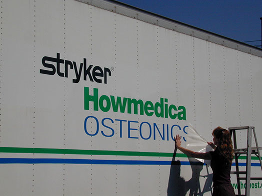 Vinyl being applied on a truck