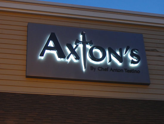 Channel letter on an exterior wall night view