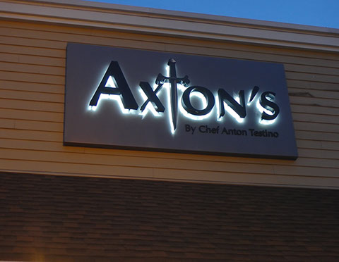 Channel letter on an exterior wall night view